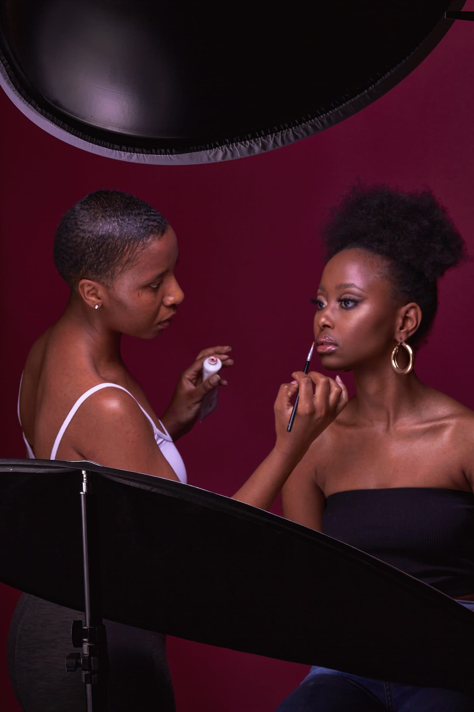 Makeup being applied in a studio